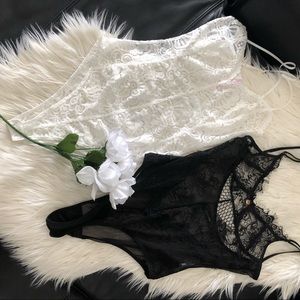 2 body suits, white one has never been worn!